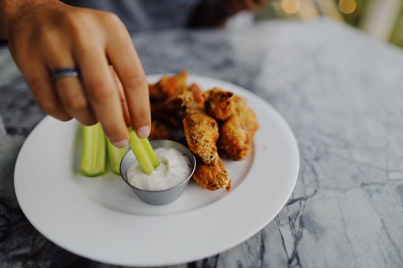 Classic Buffalo Wings with celery and blue cheese dip