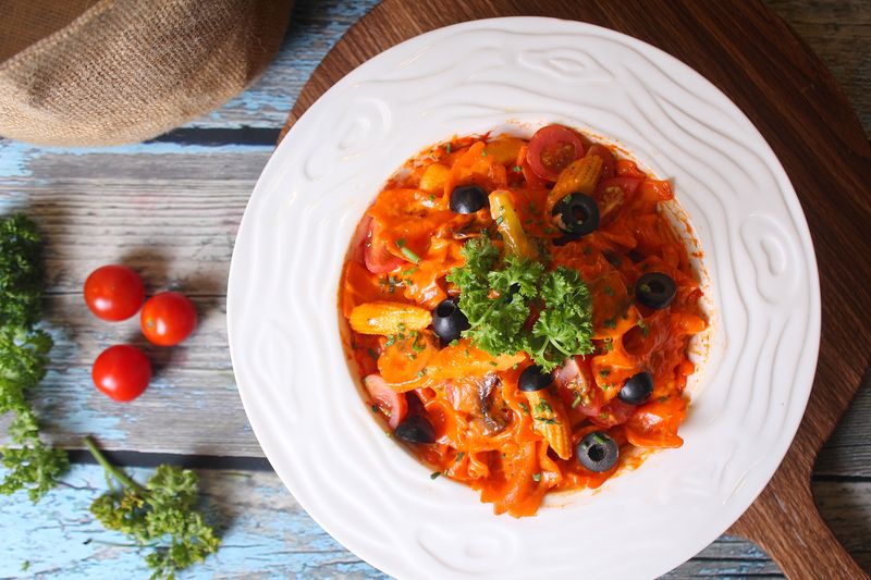 Baked Penne Arrabbiata with spicy tomato sauce and parmesan